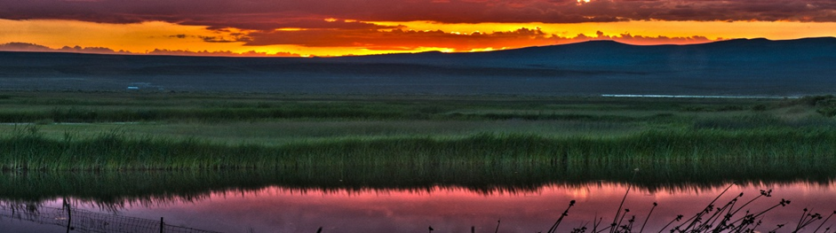 Sunset over water landscape